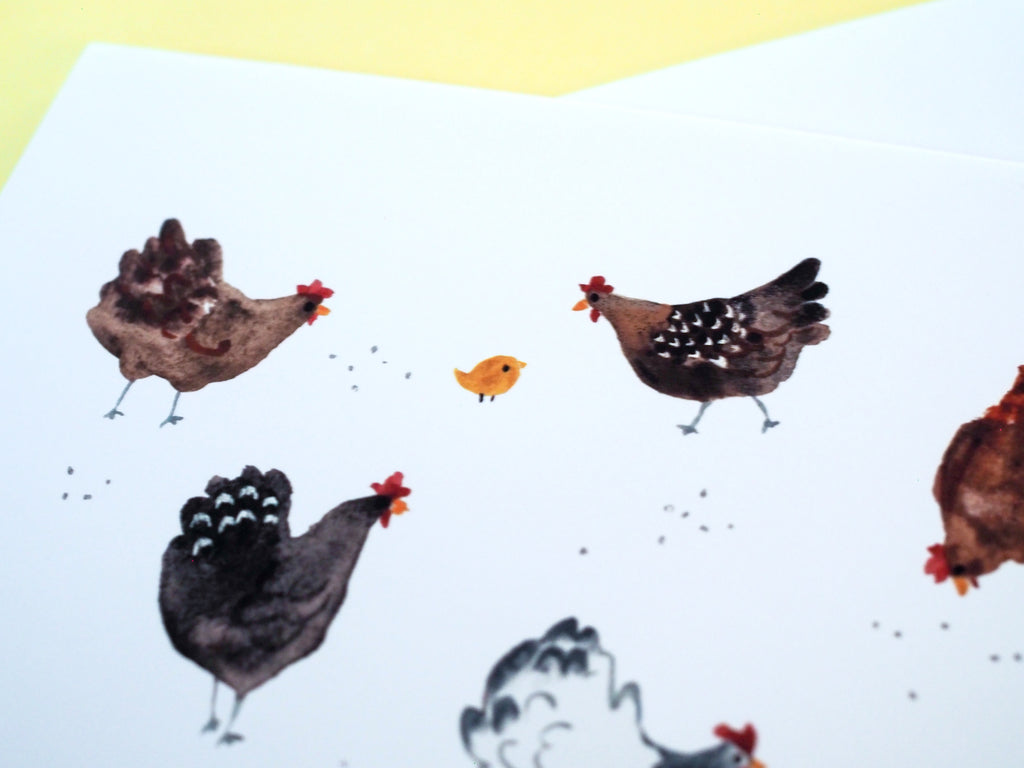 A greeting card detail photo featuring an illustration of various chickens and small chicks on the ground.